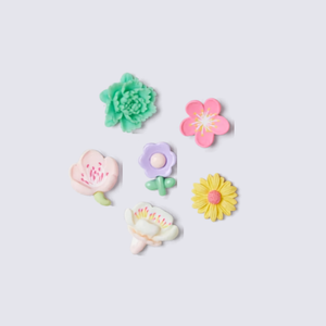 A selection of vibrant, detailed flower charms in various shapes