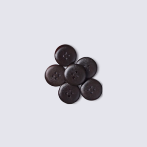 A set of dark circular buttons